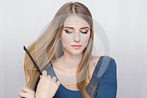 Woman brushing hair