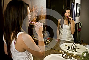 Woman brushing her teeth