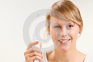 Woman brushing her teeth with tooth brush stock photo