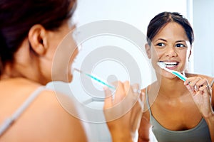 Woman brushing teeth