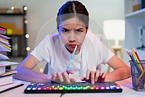 Woman brushing teeth and hand typing on keyboard and hurry to work on time.