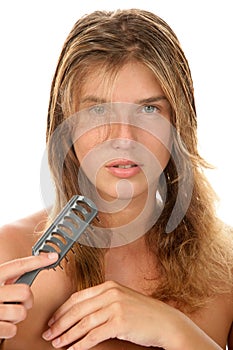 Woman brushing wet hair