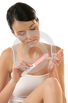 Woman buffing her nails photo