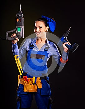 Woman builder with construction tools.