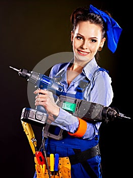 Woman builder with construction tools.