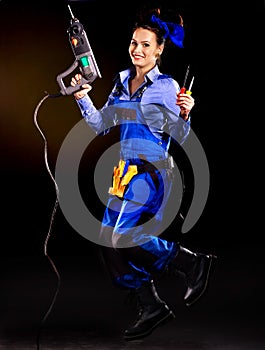 Woman builder with construction tools.