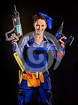 Woman builder with construction tools.