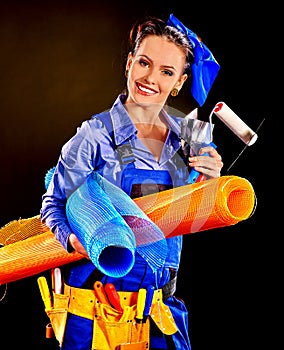 Woman builder with construction tools