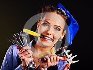 Woman builder with construction tools.