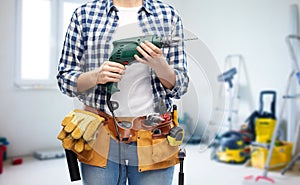 Woman or builder with drill and work tools