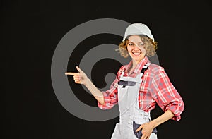 Woman builder in hardhat. Girl engineer or architect. Home renovation. Lady at construction site. Warehouse woman worker