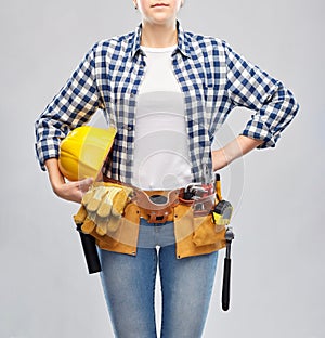 Woman or builder with helmet and working tools