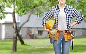 Woman or builder with helmet and working tools