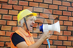 Woman builder with a megaphone