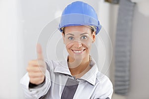 Woman builder showing thumbs up