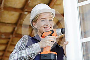 woman builder using drill