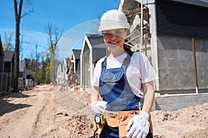 Woman building engineer ready to begin work on construction site