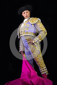 Woman bullfighter holding capote pink photo