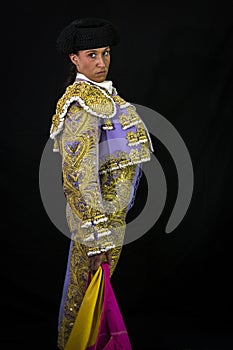 Woman bullfighter holding capote pink photo