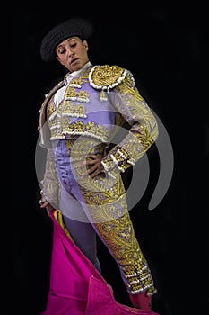 Woman bullfighter holding capote pink photo