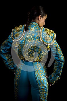 Woman bullfighter suit with blue lights photo