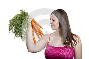 Woman with a bunch of carrots