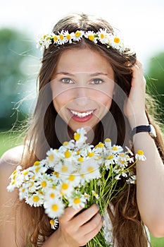 Woman with bunch of wildflowers