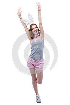 Woman with bunny ears raised hands up