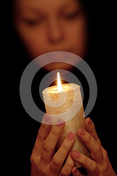 The woman with burning candle