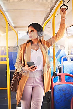 Woman, bus and traveling with headphones and phone, listening to song, music and audio in public transport. Business