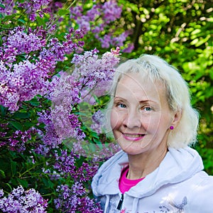 Woman from a Bush blooming lilac