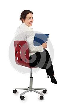 Woman in business dress sitting on chair