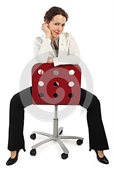 Woman in business dress sitting on red chair