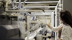 A woman buying a chrome faucet for water in a plumbing store