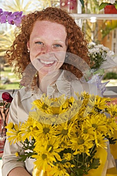 Woman buying flowers in a flower store