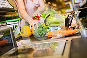 Woman buying food at the grocery store photo