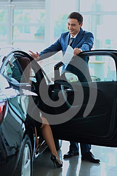 Woman buying a new car.