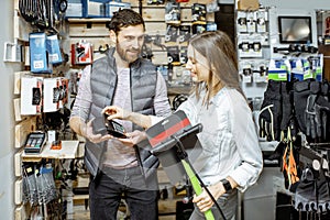 Woman buying pump at the bicycle shop