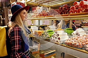 Woman Buying Turkish Sweets At Eastern Food Market