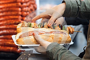 Woman buys meal at Christmas street food market