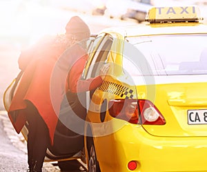 Woman, cab and taxi for transport, commute and car for vehicle, passenger and move for traffic in urban. Young person