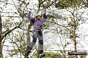 Woman on cables in an adventure park