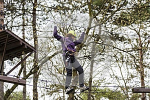 Woman on cables in an adventure park