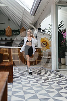 Woman in cafe on Bali island during happy hour