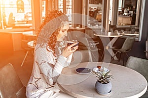 Woman cafe coffee breakfast. Portrait of an adult beautiful woman in an elegant suit in a cafe