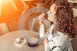 Woman cafe coffee breakfast. Portrait of an adult beautiful woman in an elegant suit in a cafe