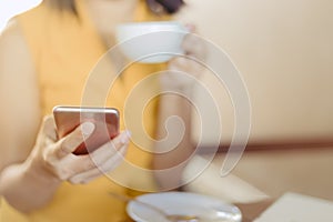 Woman at cafe drinking coffee and power full for business in the day