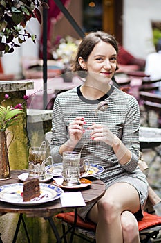 Woman at cafe hold instrument for brewing tea