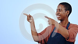 Woman, cafe and pointing for presentation in studio with hands, announcement or advertising space in smile. Black person