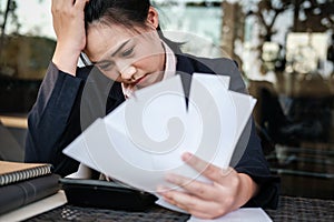 woman calculate domestic bills at home. Businesswoman using calculator at modern office. Young female checking balance & costs.